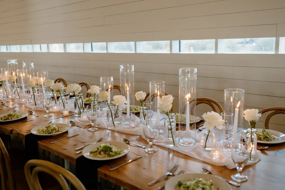 Candlelit tables set for a wedding reception