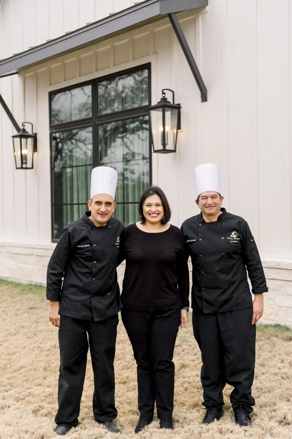 Three members of the Mana Sabroso team outside a venue